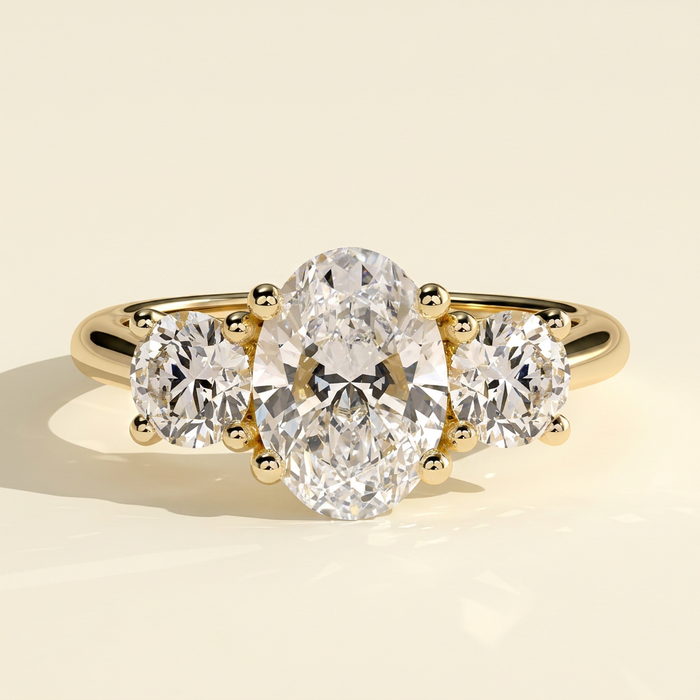 The Gemma - Oval Cut Lab Grown Diamond Three Stone Engagement Ring with Round Side Stones
