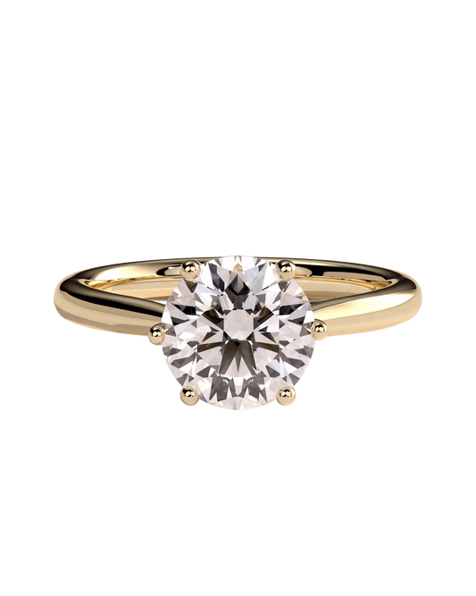 A yellow gold solitaire engagement ring with a single round brilliant diamond held in four prongs.