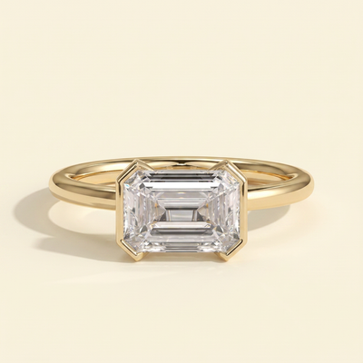 The Mara - Emerald Cut Lab Grown Diamond East West Half Bezel Solitaire Engagement Ring
