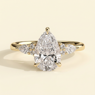 The Ilona - Pear Cut Lab Grown Diamond Three Claw Tulip Gallery Solitaire with Pear and Round Shoulder Stones Engagement Ring