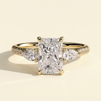 The Riviera - Radiant Cut Lab Grown Diamond Trilogy Ring with Pear Side Stones and Pave Band