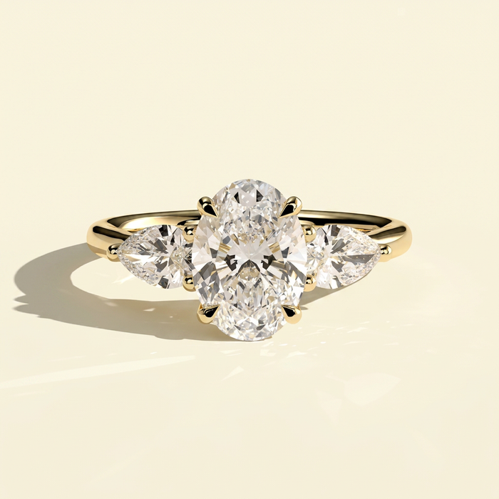 The Ayla - Oval Cut Lab Grown Diamond Three Stone Ring with Pear Side Stones