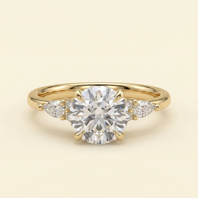 The Clea - Round Cut Lab Grown Diamond Three Stone with Pear Shoulder Stones and Tulip Gallery Engagement Ring