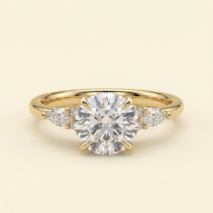 The Clea - Round Cut Lab Grown Diamond Three Stone with Pear Shoulder Stones and Tulip Gallery Engagement Ring