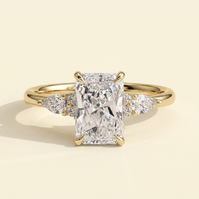 The Raina - Radiant Cut Lab Grown Diamond Three Stone Tulip Gallery Ring with Pear Side Stones
