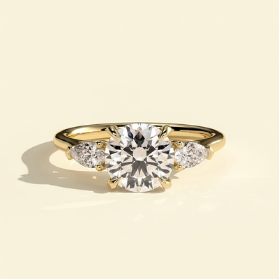 The Aurine - Round Cut Lab Grown Diamond Three Stone Ring with Pear Sides