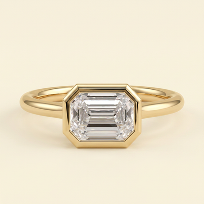 The Zaia - Emerald Cut Lab Grown Diamond East West Bezel Set Solitaire with Open Cathedral Setting Engagement Ring