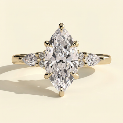 The Yara - Marquise Cut Lab Grown Diamond Six Claw Three Stone with Pear and Round Shoulder Stones Engagement Ring