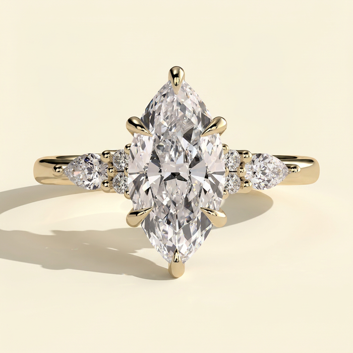 The Yara - Marquise Cut Lab Grown Diamond Six Claw Three Stone with Pear and Round Shoulder Stones Engagement Ring