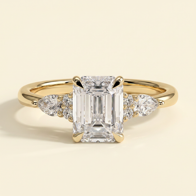 The Belisse - Emerald Cut Lab Grown Diamond Four Claw Solitaire with East West Pear and Round Shoulder Accents Engagement Ring