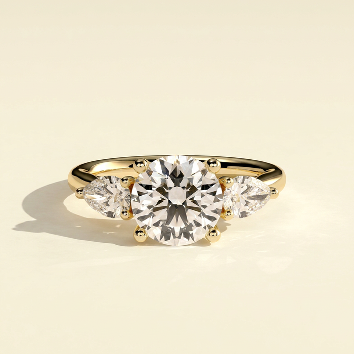 The Amara - Round Lab Grown Diamond Three Stone Ring with Pear Side Stones