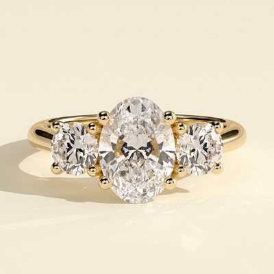 The Gemma - Oval Cut Lab Grown Diamond Three Stone Engagement Ring with Round Side Stones