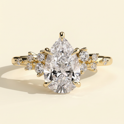 The Zivelle - Pear Cut Lab Grown Diamond Basket Set Solitaire with Clustered Round Shoulder Stones Engagement Ring