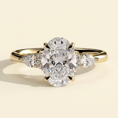 The Rialta - Oval Cut Lab Grown Diamond Three Stone Engagement Ring with Pear and Round Side Stones