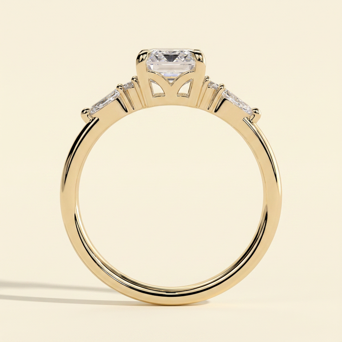 The Belisse - Emerald Cut Lab Grown Diamond Four Claw Solitaire with East West Pear and Round Shoulder Accents Engagement Ring