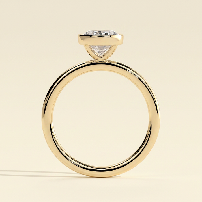 The Uriela - Oval Cut Lab Grown Diamond Bezel Set Solitaire Engagement Ring