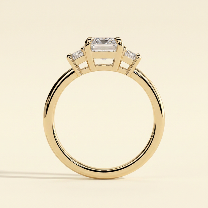 The Miriana - Emerald Cut Lab Grown Diamond Three Stone Engagement Ring with Matching Emerald Side Stones and Low Basket Setting
