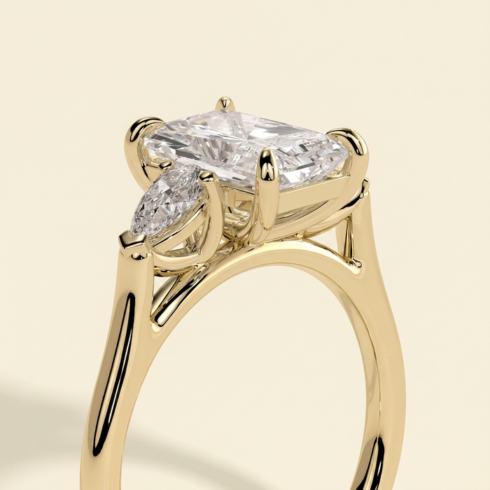 The Mirabel - Radiant Cut Lab Grown Diamond Three Stone Engagement Ring with Pear Side Stones
