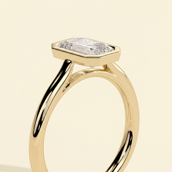 The Helia - Emerald Cut Lab Grown Diamond Bezel Set Solitaire with Open Cathedral Engagement Ring