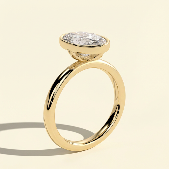 The Kelia - Oval Lab Grown Diamond Bezel Solitaire with Petal Gallery Setting