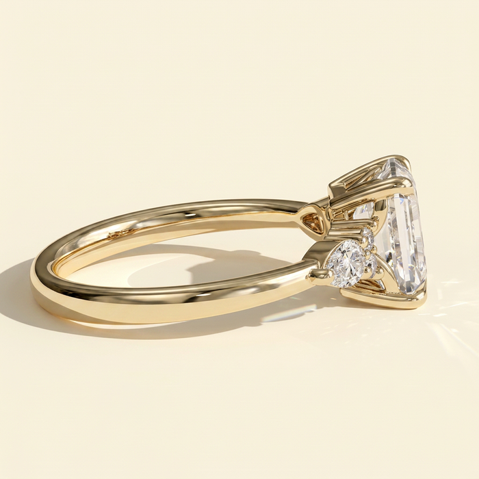 The Belisse - Emerald Cut Lab Grown Diamond Four Claw Solitaire with East West Pear and Round Shoulder Accents Engagement Ring