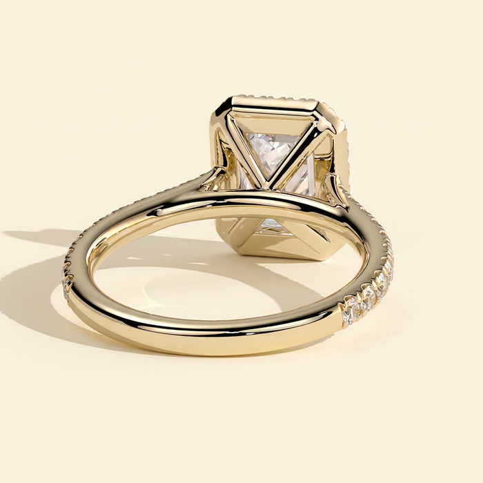 The Delara - Emerald Cut Lab Grown Diamond Four Claw Halo Engagement Ring with Pave Band
