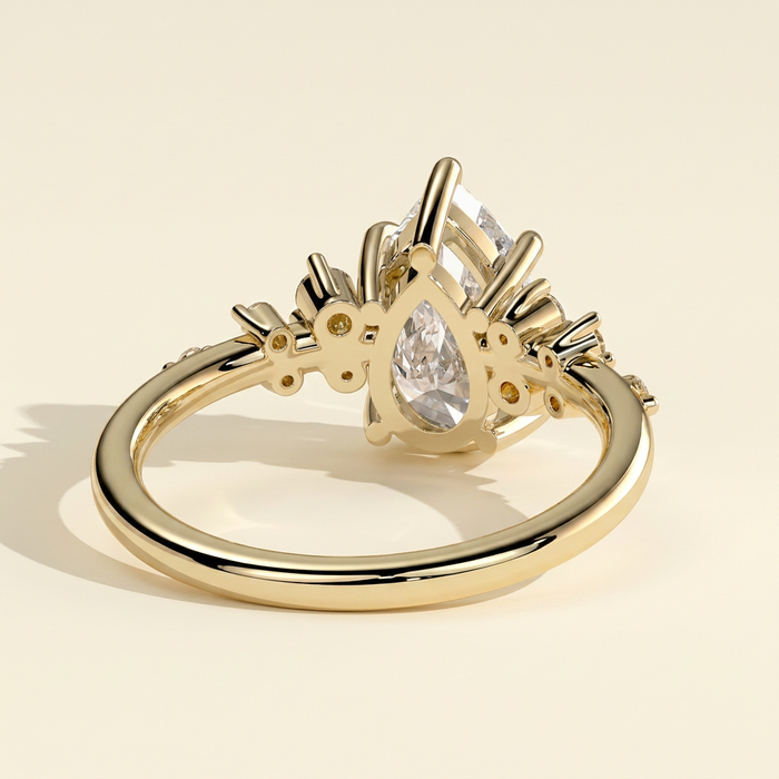 The Zivelle - Pear Cut Lab Grown Diamond Basket Set Solitaire with Clustered Round Shoulder Stones Engagement Ring