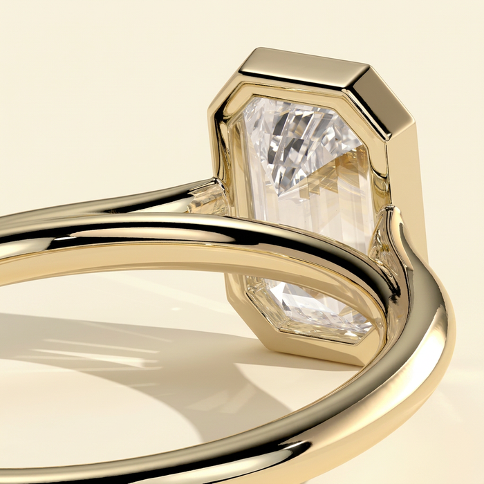 The Helia - Emerald Cut Lab Grown Diamond Bezel Set Solitaire with Open Cathedral Engagement Ring